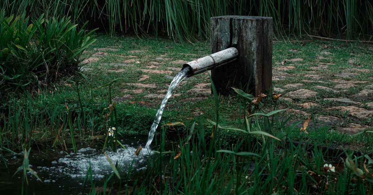 Water pouring from a pipe during flooding